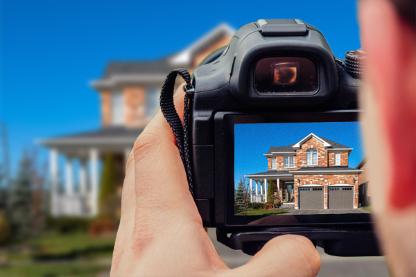 man taking photo of real estate image